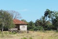 A very old wooden house with a rusty roof