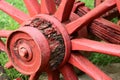 Very old wooden wagon wheel, painted bright red