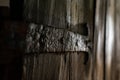 Very old wrought iron door hinge. Antique door image.Selective focus.