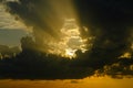 Very ominous thunderstorm clouds before a thunderstorm with sun rays. Royalty Free Stock Photo