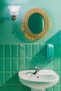 Very original bathroom in a green color.