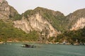 Fishers houses on green water in Halong Bay