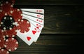 A very popular poker game with a winning combination of high cards. Cards with chips on a black vintage table in a poker club