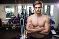 Very power athletic guy , execute exercise with dumbbells, in gym hall Royalty Free Stock Photo