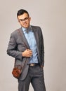 A very presentable young businessman with glasses and a butterfly and a good purse