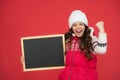 Very profitable proposition. happy girl empty blackboard. copy space. useful information here. winter activity Royalty Free Stock Photo