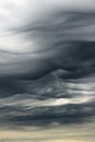 Very rare dark grey stratus clouds. Stratus undulatus in Latin language. Upper atmosphere, troposphere. Aerial view, skyscape.