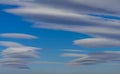 Very rare sighting of several lenticular clouds