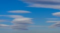 Very rare sighting of several lenticular clouds