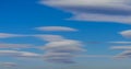 Very rare sighting of several lenticular clouds