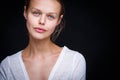 Very retty young woman's simple studio portrait