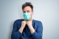Very scared man in a respiratory mask is afraid of contracting a virus. Royalty Free Stock Photo