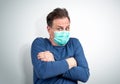 Very scared man in a respiratory mask is afraid of contracting a virus. Royalty Free Stock Photo