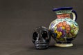 A very serious Talavera Puebla vase with a black Oaxaca skull