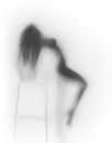 Very woman body silhouette behind a glass wall