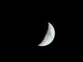 Very sharp close-up of the rising crescent moon in the night sky Royalty Free Stock Photo