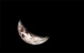 Very sharp close-up of the rising crescent moon in the night sky. Royalty Free Stock Photo