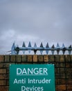 Property protection with sign. Danger Anti Intruder Devices Royalty Free Stock Photo