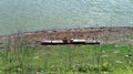 Very simple boat on the edge of the reservoir