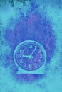 A very simple round blue clock against empty ethereal  background Royalty Free Stock Photo