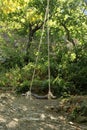 Very simple swing made of wood and rope