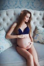 Very skinny vegetarian healthy pregnant women beautiful model in underwear at bright studio