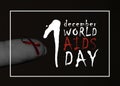 Very smal red ribbon on tip if the finger world aids day concept