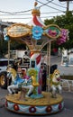 Very small colorful carousel merry go round.