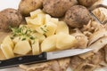 Into small dice cut organic potatoes Royalty Free Stock Photo