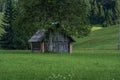 Very small old wooden cottage hut house in pristine nature Royalty Free Stock Photo