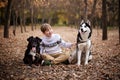 Walking the dogs in the autumn park Royalty Free Stock Photo