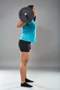 Strong latino woman doing squats with barbell Royalty Free Stock Photo