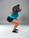 Strong latino woman doing squats with barbell Royalty Free Stock Photo