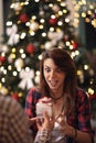 Surprised and curious woman receiving Christmas gift