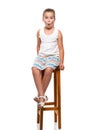 very surprised girl sitting on a chair Royalty Free Stock Photo