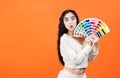 Very surprised woman with color palette fun. Paint and painting concept. Interior designer woman holding color palette guide Royalty Free Stock Photo