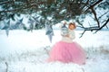 Very sweet beautiful little smiling girl child in pink skirt, white pullover, gray scarf and floral wreath with lantern in hands. Royalty Free Stock Photo