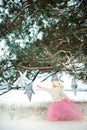 Very sweet beautiful little smiling girl child in pink skirt, white pullover and hat, gray scarf with old fashioned lantern in Royalty Free Stock Photo