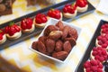 Very sweet delicious small cakes made from berries and figs for candy bar Royalty Free Stock Photo