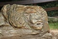 wood carved into lions head, at Southwicks Zoo,