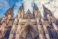 A very tall cathedral stands tall against a breathtaking sky, dominating the surrounding landscape, A gothic cathedral with