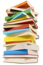 Very tall pile of books on white background, low angle view Royalty Free Stock Photo