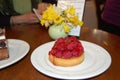 Very tasty and beautiful tartelette with raspberry in cafe, Annecy, France