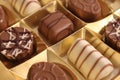 Very tasty chocolates from chocolate and nougat in a golden package Royalty Free Stock Photo