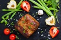 Very tasty cooked beef with spices and vegetables on old table Royalty Free Stock Photo