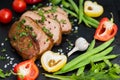 Very tasty cooked beef with spices and vegetables on old table Royalty Free Stock Photo