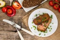 Very tasty cooked beef with spices and vegetables on wooden old table Royalty Free Stock Photo