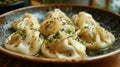 Very tasty manti left on a plate, sprinkled with herbs Royalty Free Stock Photo