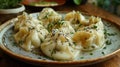 Very tasty manti left on a plate, sprinkled with herbs Royalty Free Stock Photo