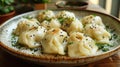 Very tasty manti left on a plate, sprinkled with herbs Royalty Free Stock Photo